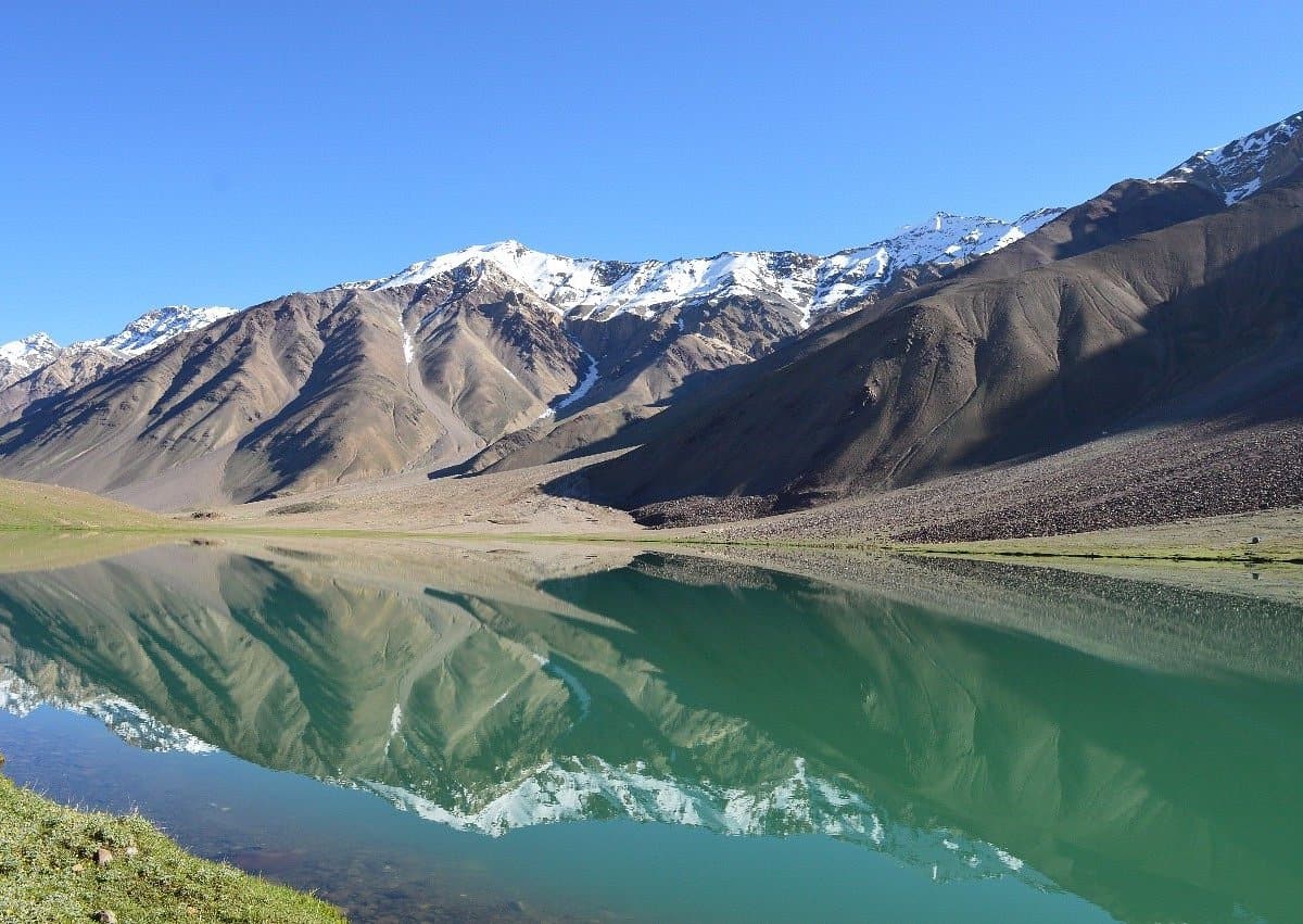 a lake with mountains in the background, Chandratal Lake